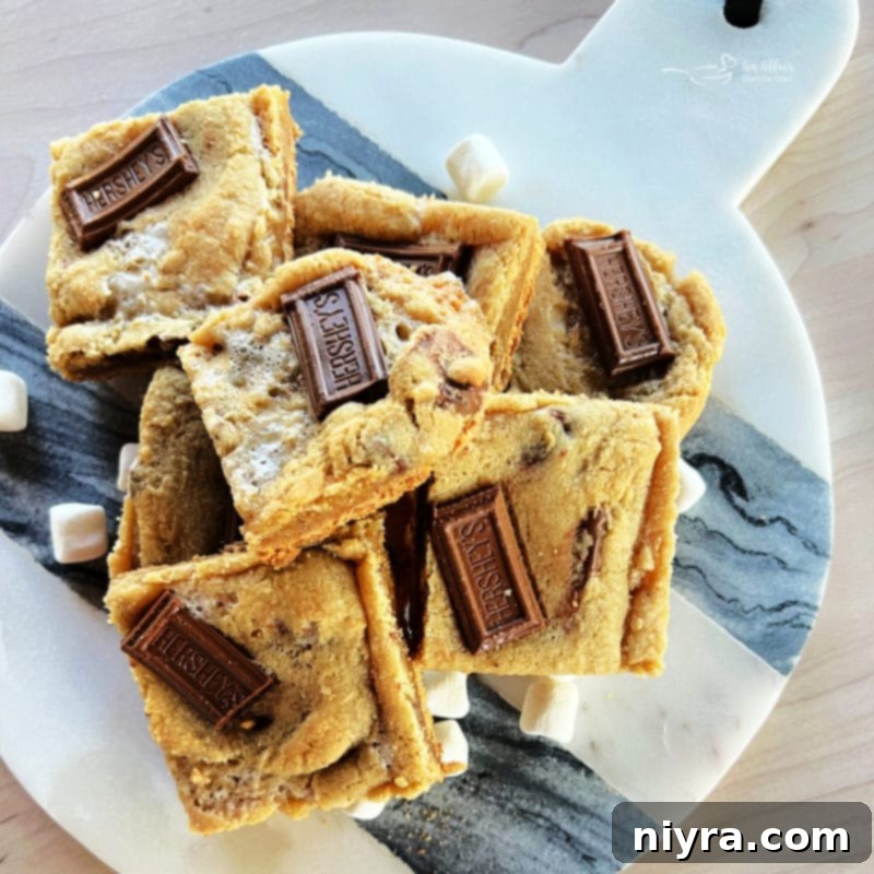 SMores Cookie Bars 3 Tray of freshly baked S'mores Cookie Bars with melted chocolate and marshmallows