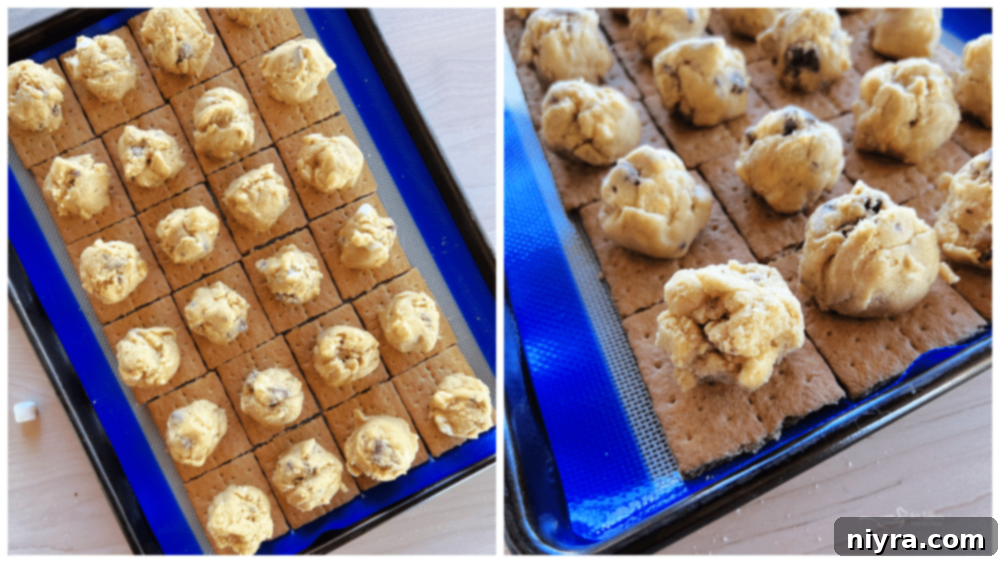 SMores Cookie Bars 9 Cookie dough balls placed on graham cracker squares on a baking sheet