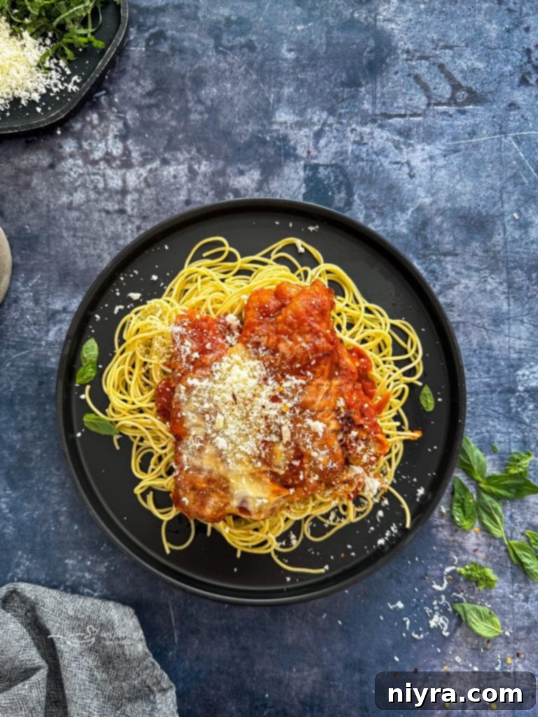 Two pieces of Easy Weeknight Chicken Parmesan on a plate