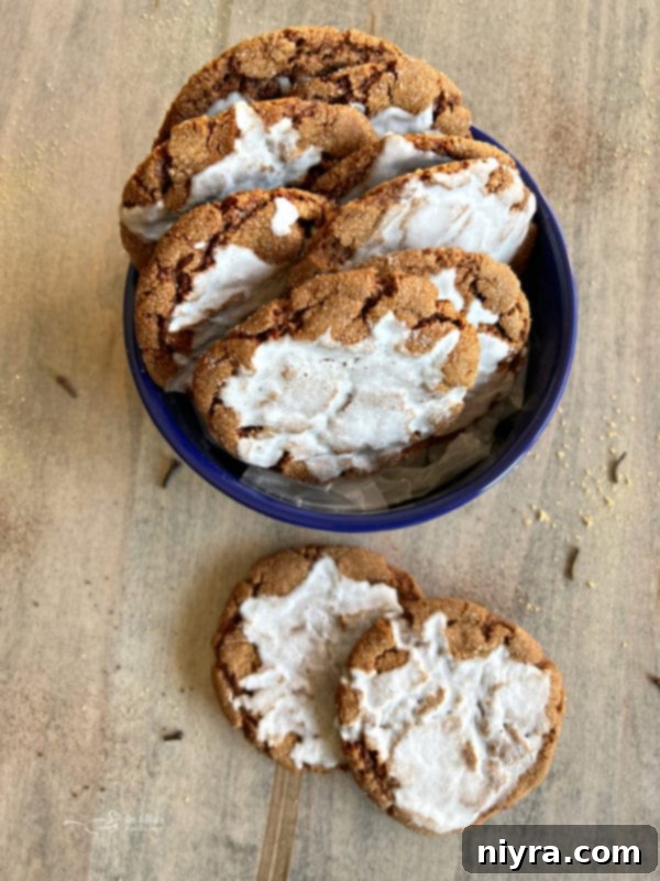 molasses cookies with icing in blue bowl 