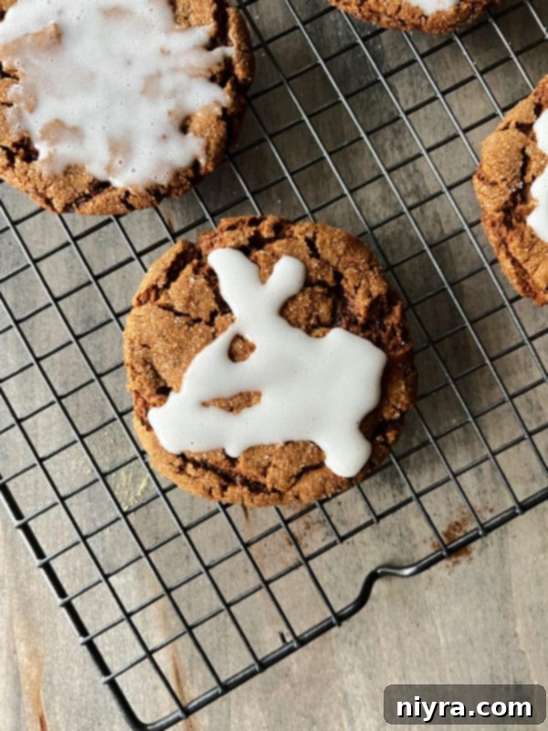 iced molasses cookies on wire rack 