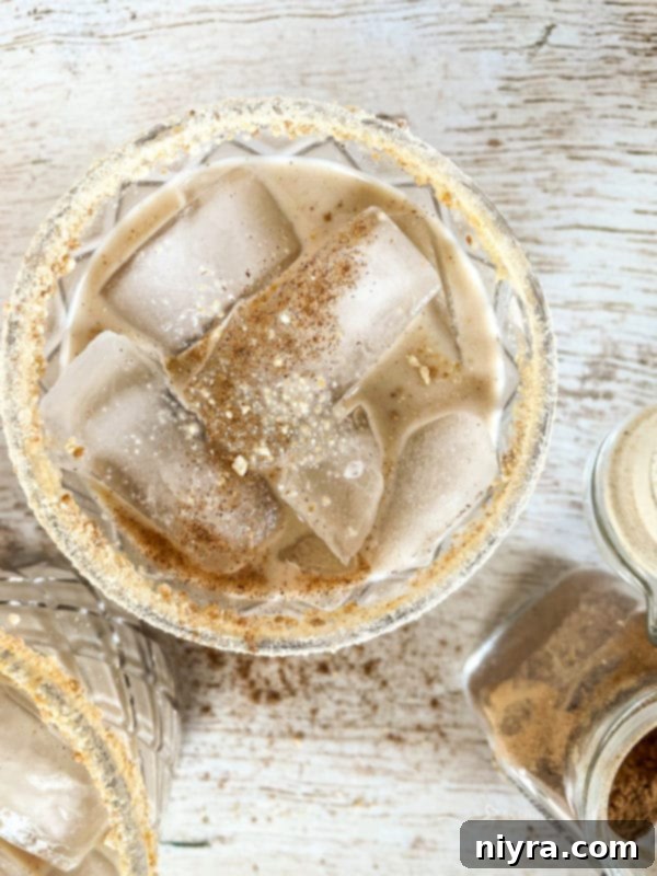 Pumpkin White Russian Cocktail in a glass, garnished with pumpkin pie spice