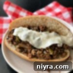 Philly Cheesesteak Sloppy Joes 11 Overhead of Philly Cheese Steak Sloppy Joe's on a white plate