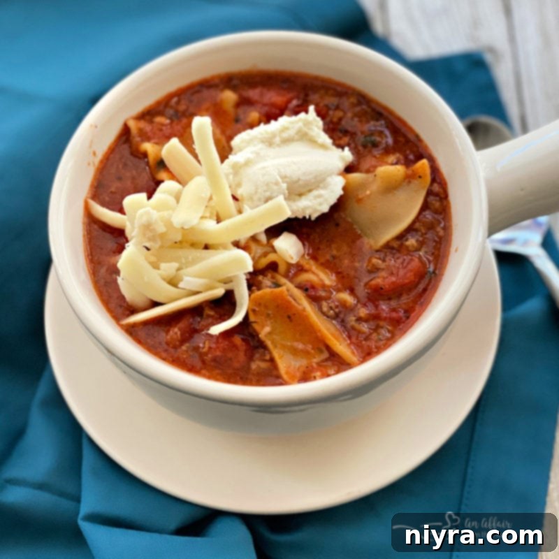Close-up of Lasagna Soup topped with ricotta and mozzarella