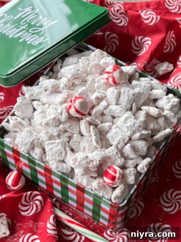 Christmas Candy Cane Puppy Chow A box of festive candy cane puppy chow, perfectly crunchy and sweet for the holidays.