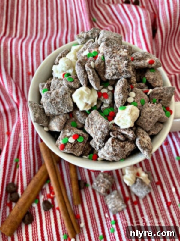 Peppermint Bark Puppy Chow 3 Mexican Hot Chocolate Chex Mix with sprinkles in a white bowl, looking spicy and sweet.