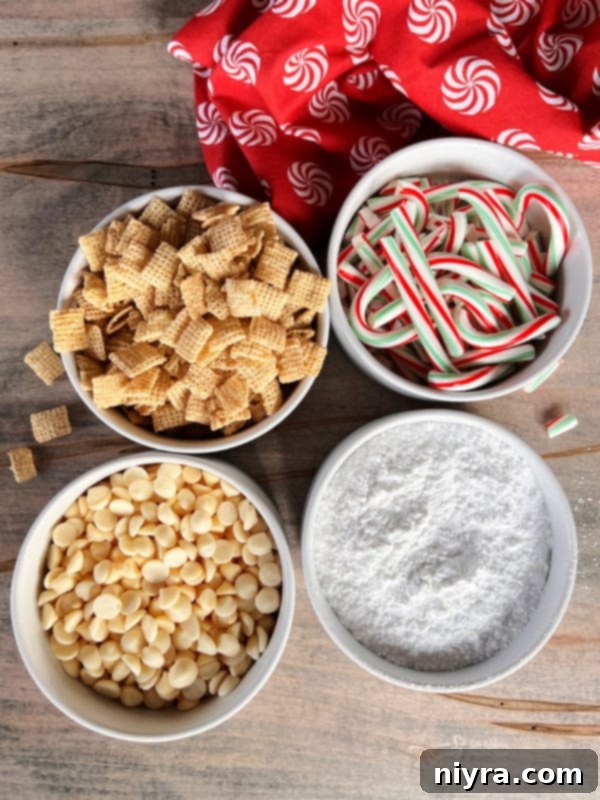 Christmas Peppermint Puppy Chow Recipe Ingredients Four separate bowls showcasing the key ingredients: Chex mix, candy canes, white chocolate, and powdered sugar.