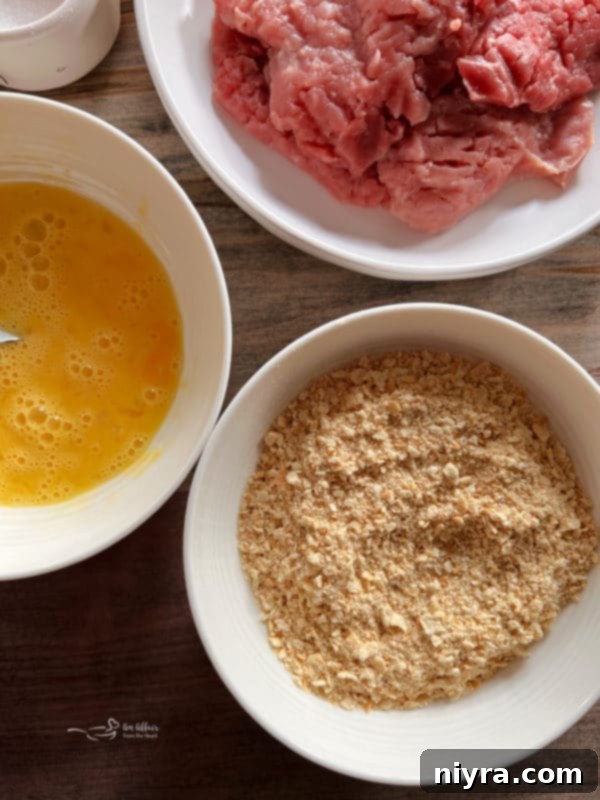 Crispy Breaded Pork Cutlets 7 Seasoned and breaded pork cutlets ready for frying