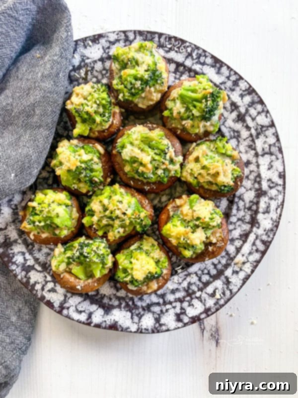 A beautifully arranged plate of broccoli stuffed mushrooms, ready to be enjoyed.