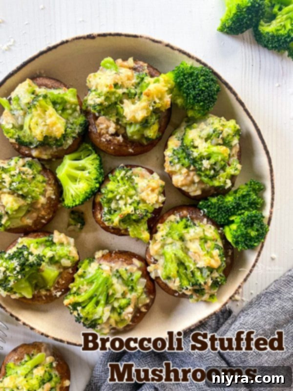A serving platter filled with baked broccoli stuffed mushrooms.