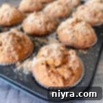 Close up of Pumpkin Spice Banana Muffins in a muffin tin