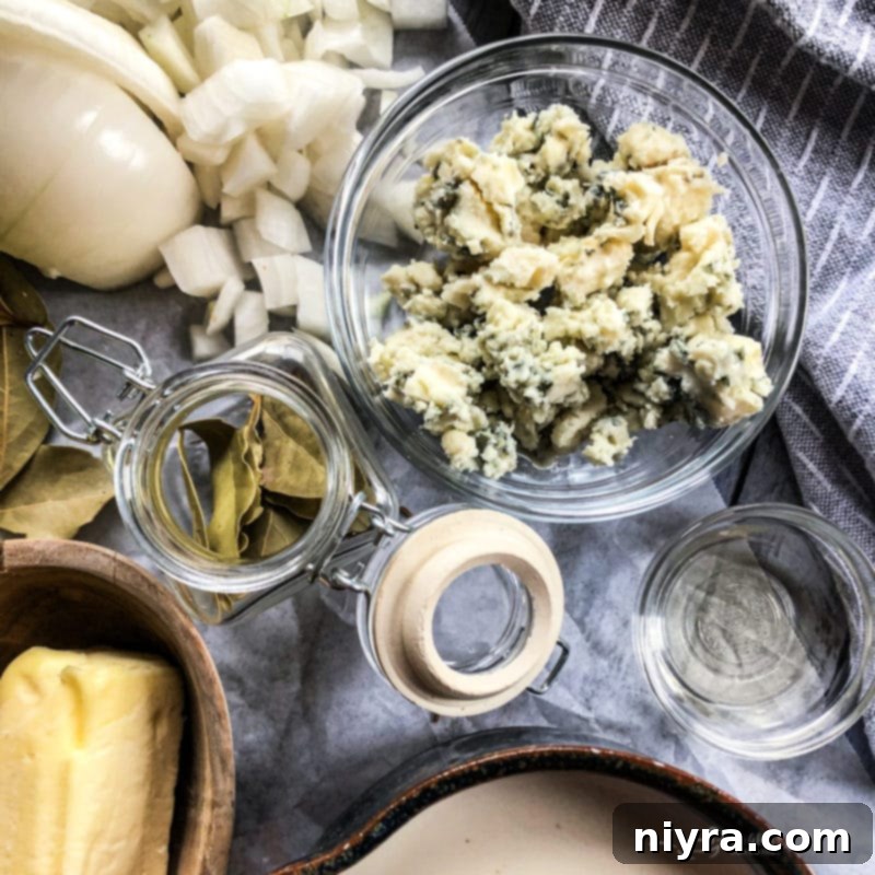 A large pot of creamy cabbage and blue cheese soup being stirred.