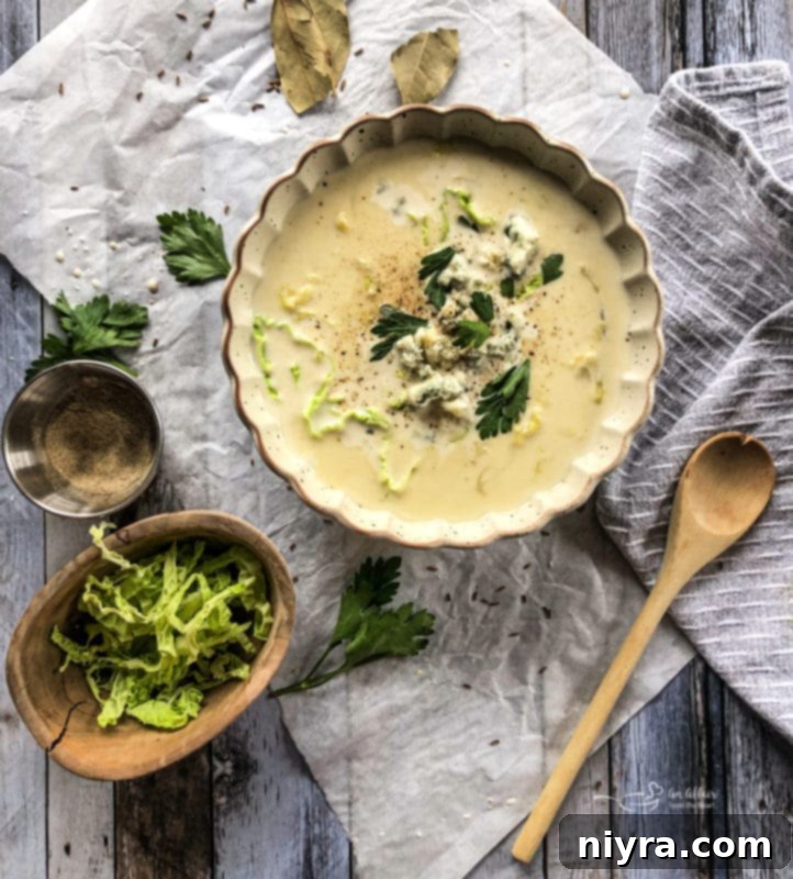 Ingredients for creamy cabbage and blue cheese soup laid out on a table.