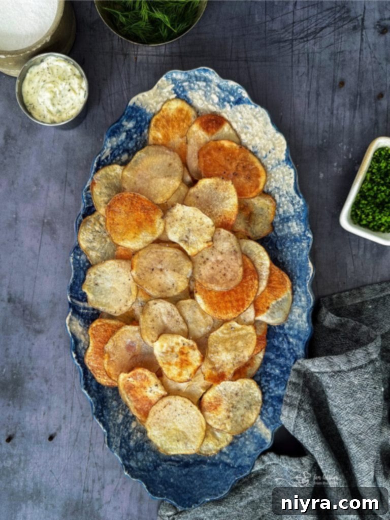 Crispy homemade baked potato chips in a bowl