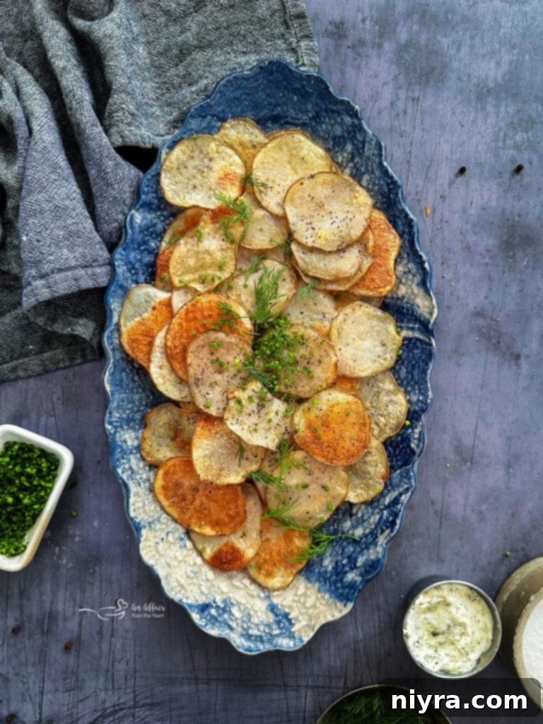 Homemade baked potato chips served in a rustic bowl