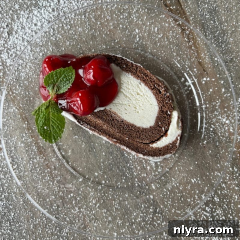 slice of ice cream cake roll, showing the perfect swirl of cake and ice cream