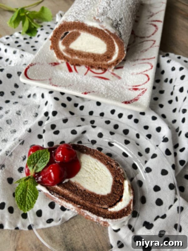 ice cream roll cake slice from the loaf, showcasing its beautiful spiral layers