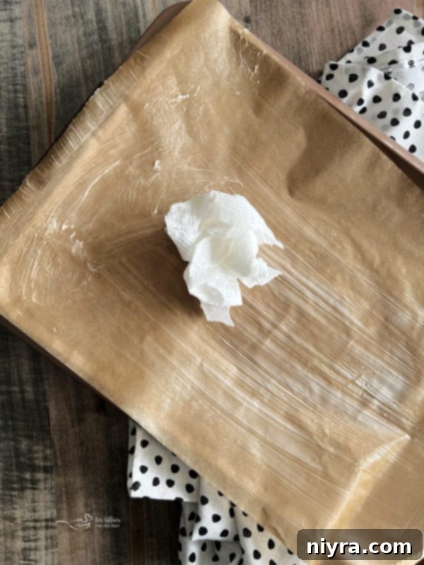 Crisco for greasing cake pan, showing the preparation step