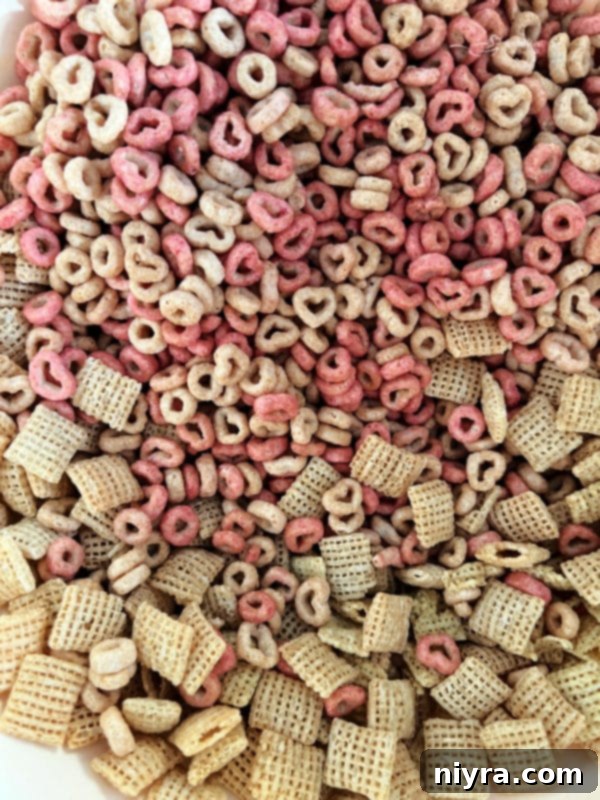 Ingredients for White Chocolate Strawberry Muddy Buddies laid out, ready for preparation.