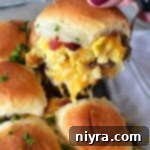 close view of breakfast slider with cheese and parsley