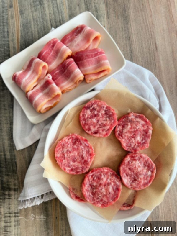 bacon and sausage patties on white plates