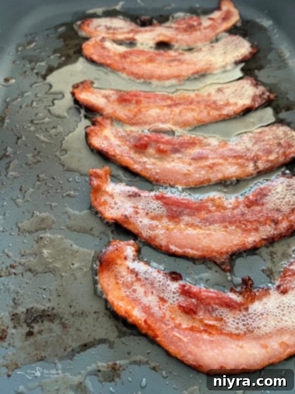 bacon cooking in pan 