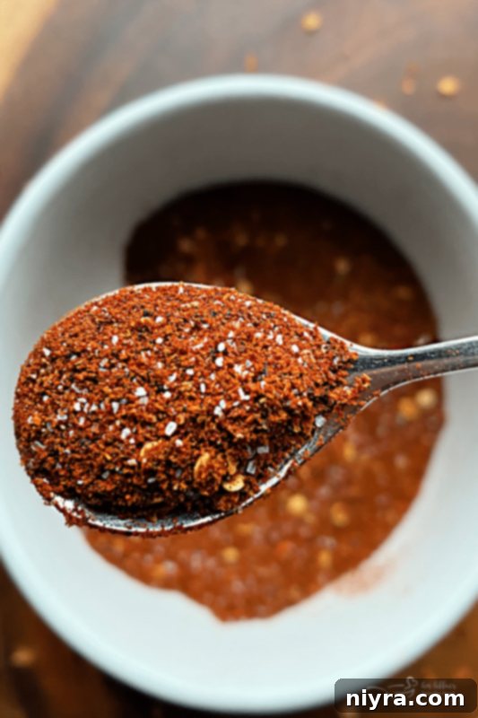 DIY Lemon Pepper Perfection 3 Homemade Chili Seasoning in white bowl spoonful