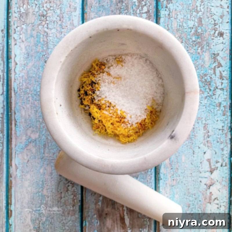 DIY Lemon Pepper Perfection 8 Adding dried lemon zest and salt to ground peppercorns in a spice grinder