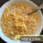 Creamy homemade creamed corn in a serving bowl, ready to be enjoyed.