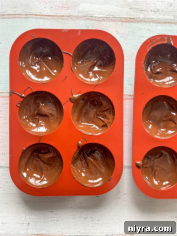silicone trays with melting chocolate for hot chocolate bombs