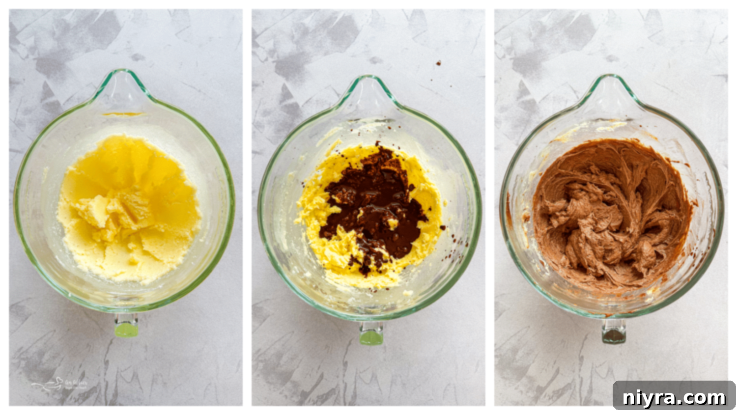 A stand mixer bowl containing creamed butter and sugar, with egg yolks being added one at a time.
