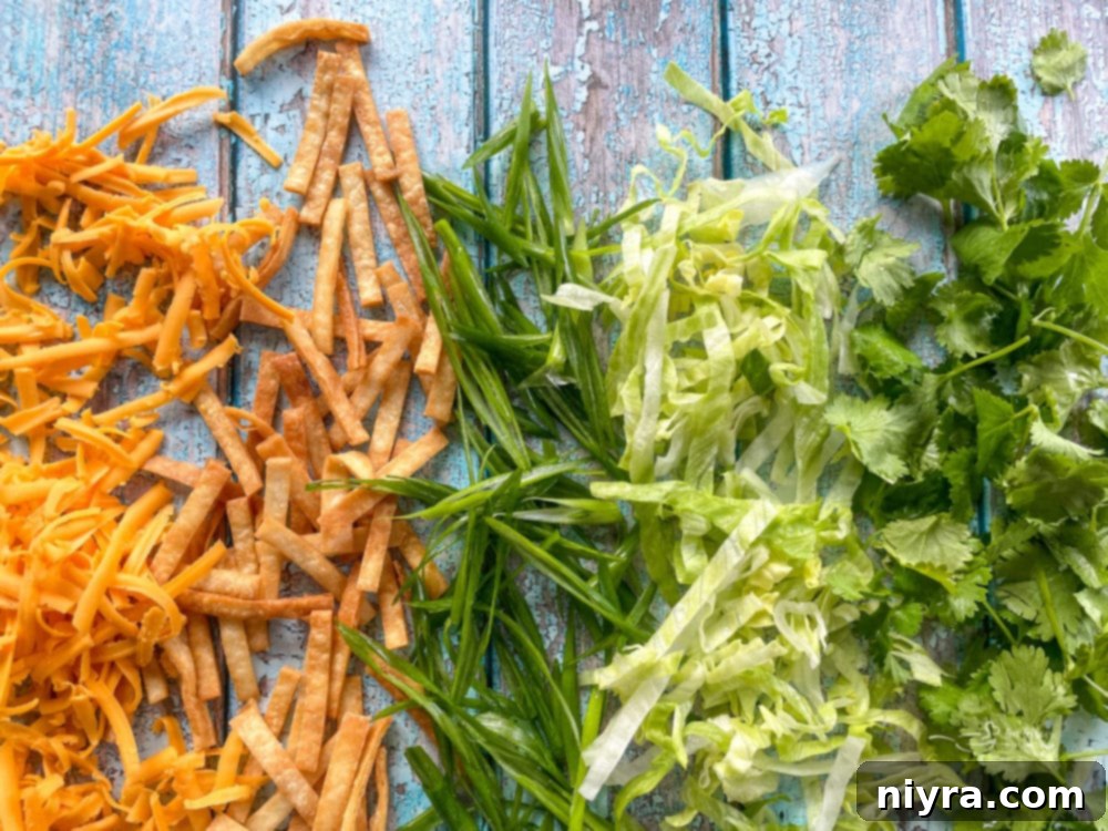 Chopped fresh cilantro and corn tortilla strips ready to be added to tortilla soup.