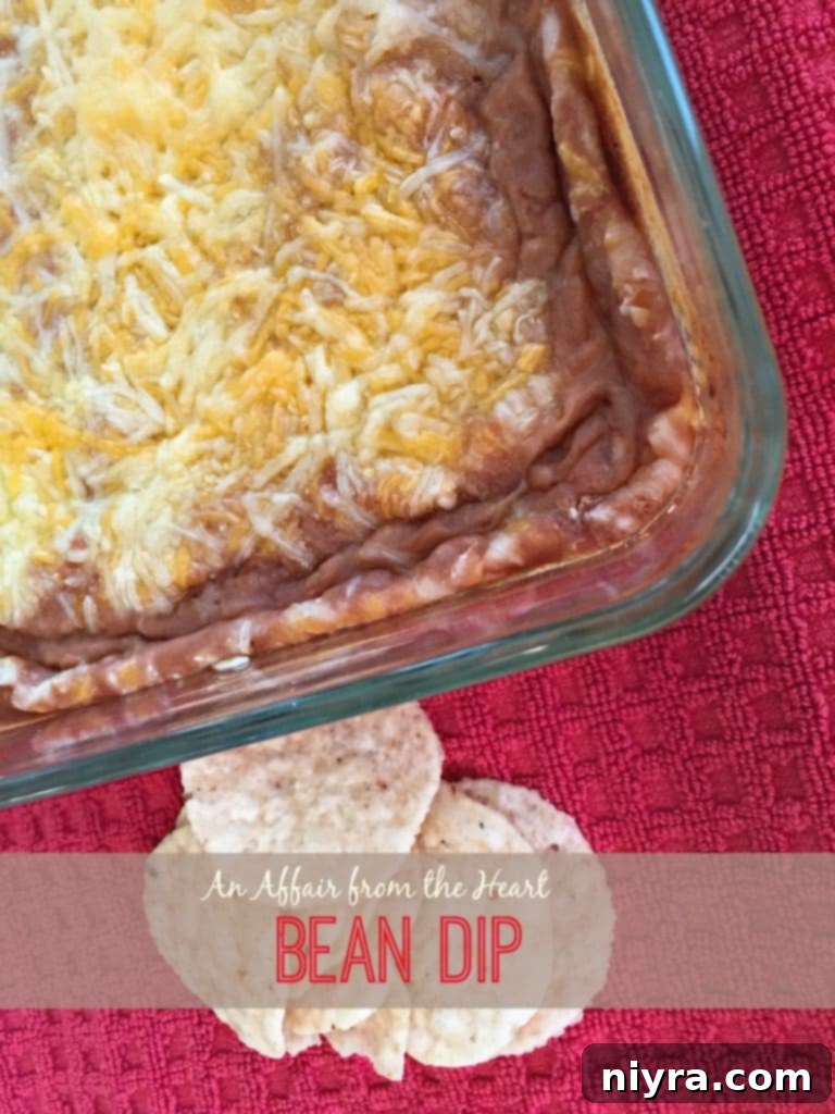 Restaurant Style Bean Dip in a white bowl with chips