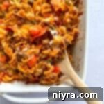 Pizza and Pasta Perfection 17 Pizza pasta being scooped out with a wooden spoon