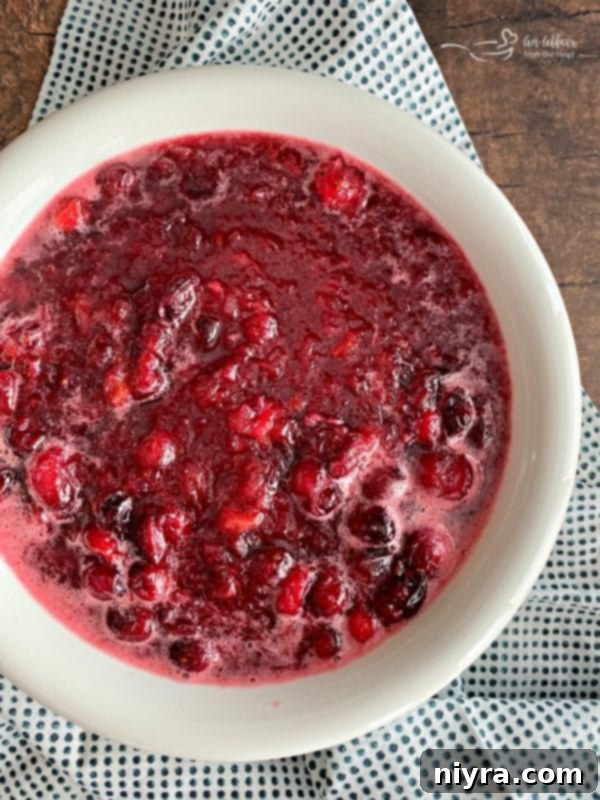 Homemade Cranberry Goodness 8 Homemade cranberry sauce in a bowl, just removed from the stove, beginning the cooling and thickening process.