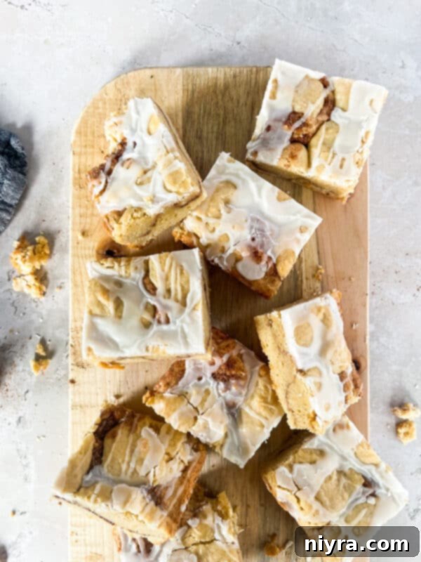 Iced Snickerdoodle Cookie Bars, a delightful variation on the classic snickerdoodle, drizzled with sweet icing.