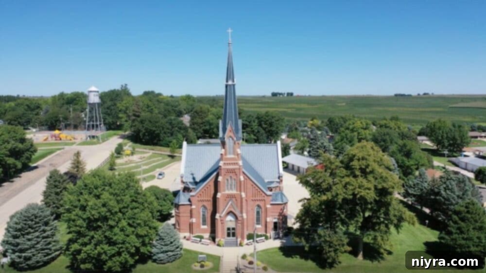 Scenic view of a church in a rural Iowa landscape, symbolizing community and agricultural roots.
