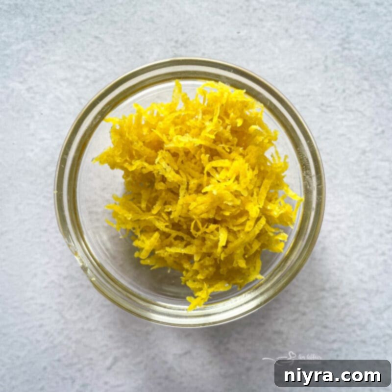 Zesty Lemon Blueberry Crumb Bars 15 lemon zest in a bowl for lemon crumb bars