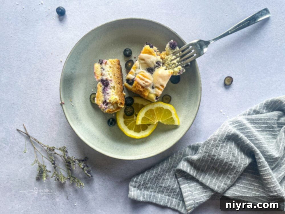 Zesty Lemon Blueberry Crumb Bars 3 serving of lemon blueberry crumb bars in a bowl