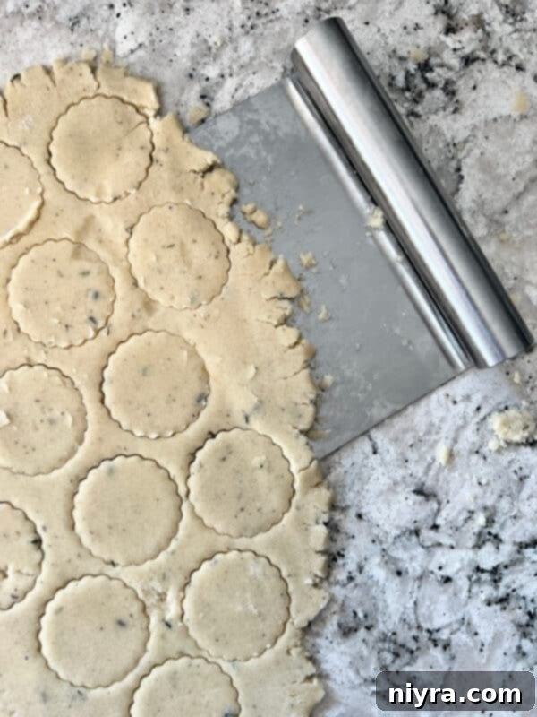 Lavender Shortbread and Lavender Strawberry Dream 15 Heart-shaped lavender shortbread cookies neatly arranged on a parchment-lined baking sheet before baking.