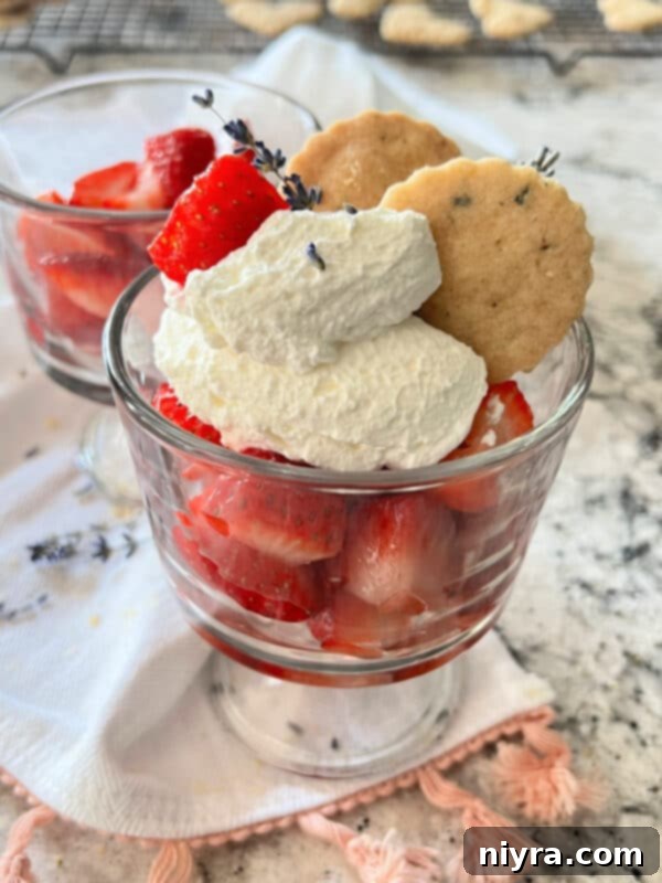Lavender Shortbread and Lavender Strawberry Dream 5 Gourmet lavender shortbread dessert featuring cookies, whipped cream, and lavender-infused strawberries in a glass.