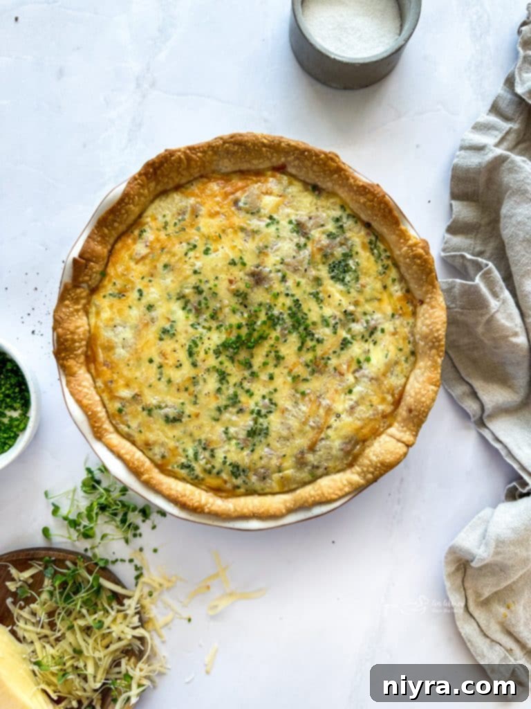 A whole Smoked Ham and Gouda Quiche cooling on a wire rack.