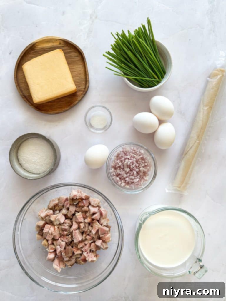 Ham and Smoked Gouda Quiche on a wooden cutting board, ready to be served.