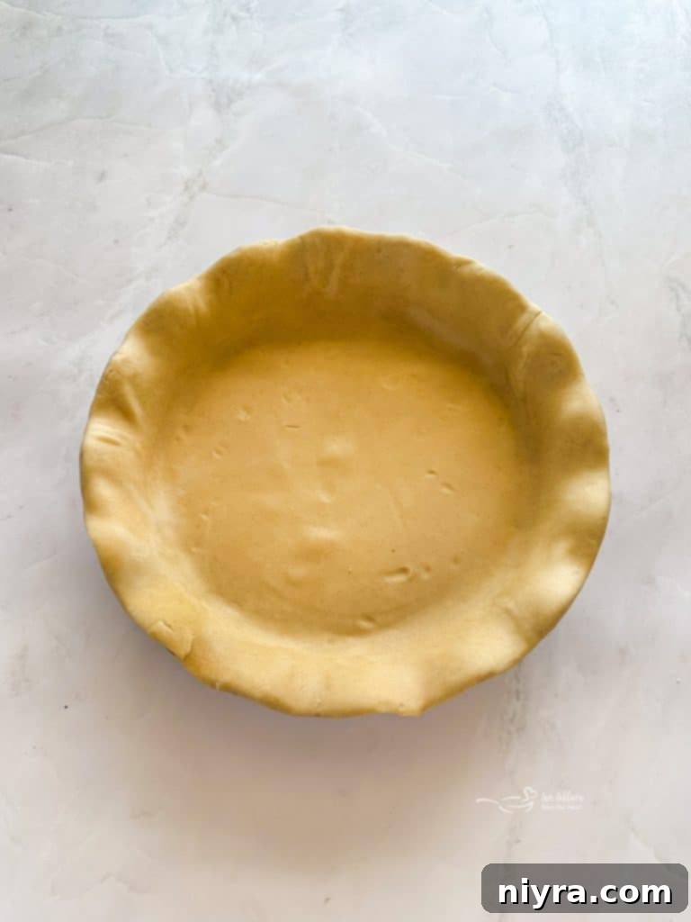 Prepared pie crust in a deep dish pie plate.