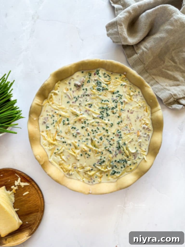 Mixing eggs and half & half in a bowl.