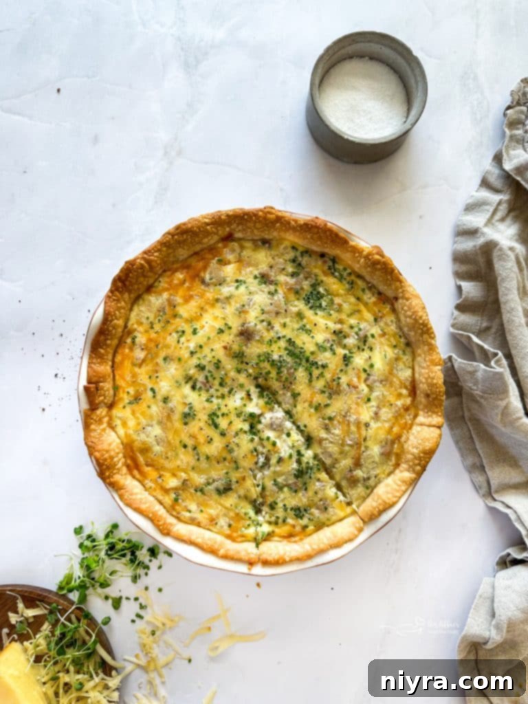 Pouring egg mixture over the quiche fillings.