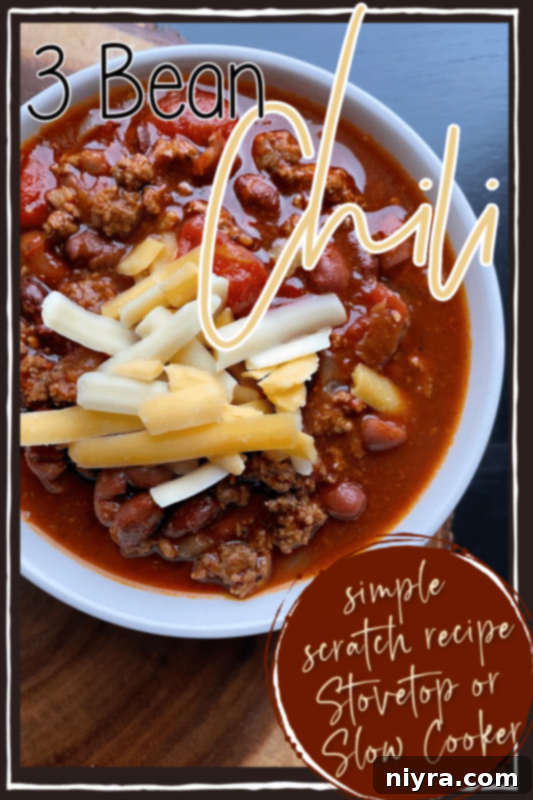 A bowl of Three Bean Chili with various toppings next to a Pinterest button encouraging sharing.