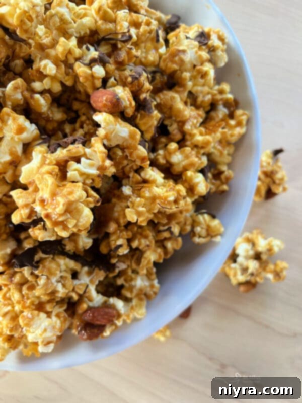 Ultimate Homemade Caramel Chocolate Nut Popcorn 3 Close-up of Homemade Moose Munch Popcorn with luxurious chocolate drizzle