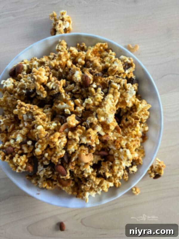 Ultimate Homemade Caramel Chocolate Nut Popcorn 4 A generous spread of Homemade Moose Munch Popcorn on a baking sheet