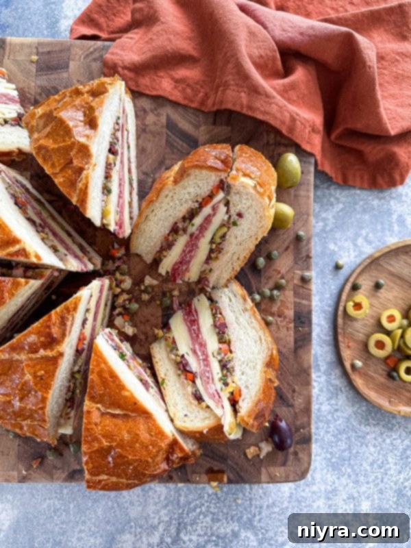 New Orleans Iconic Muffuletta 2 Classic New Orleans Muffuletta Sandwich with layers of meat and cheese